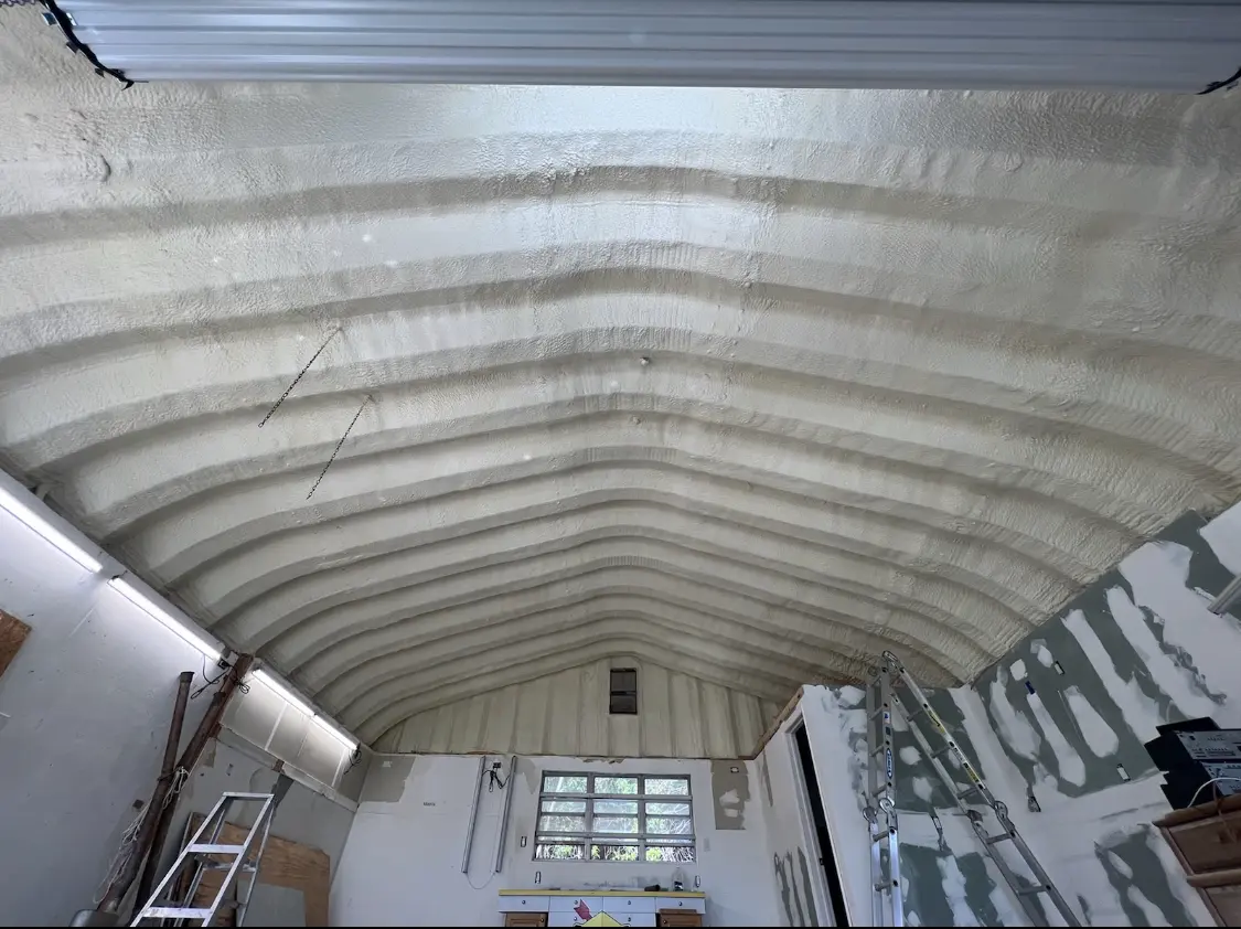 Spray polyurethane foam applied to the underside of a metal roof deck in Escondido